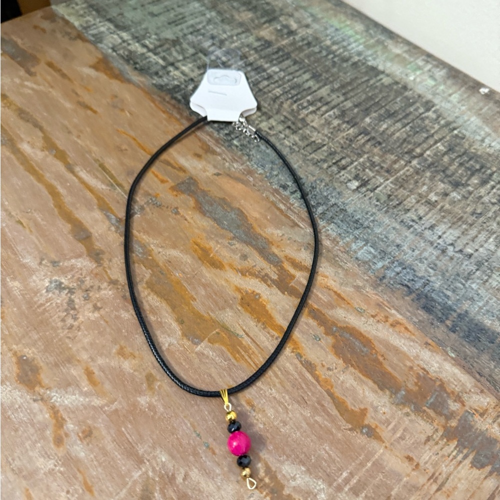 Handmade Fuchsia and black Bead necklace on black cord. New with tag
